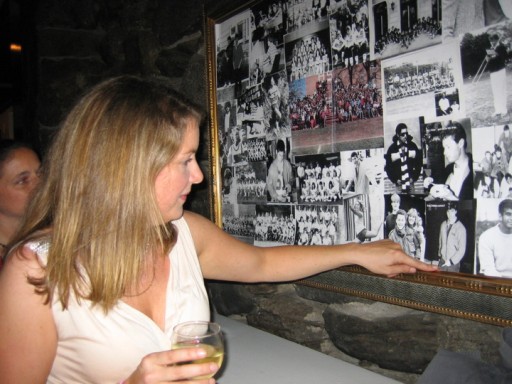 Amy Drabek pointing to a picture of her husband, Greg Siddons